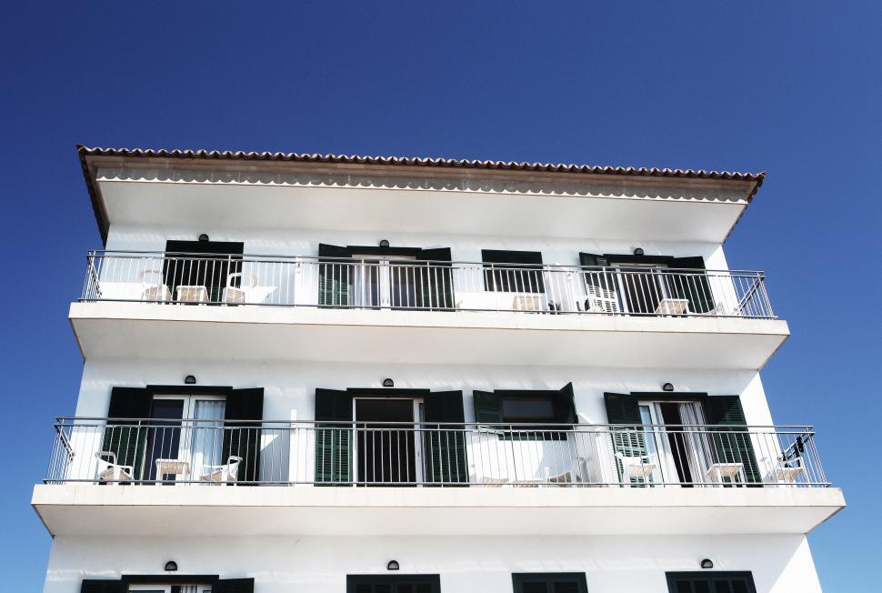 Free Image of White Building With Balconies and Balconies on Balconies 