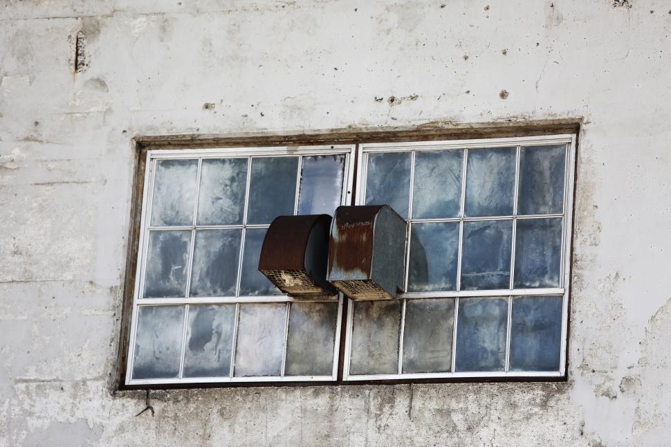 Free Image of Broken Window on the Side of a Building 