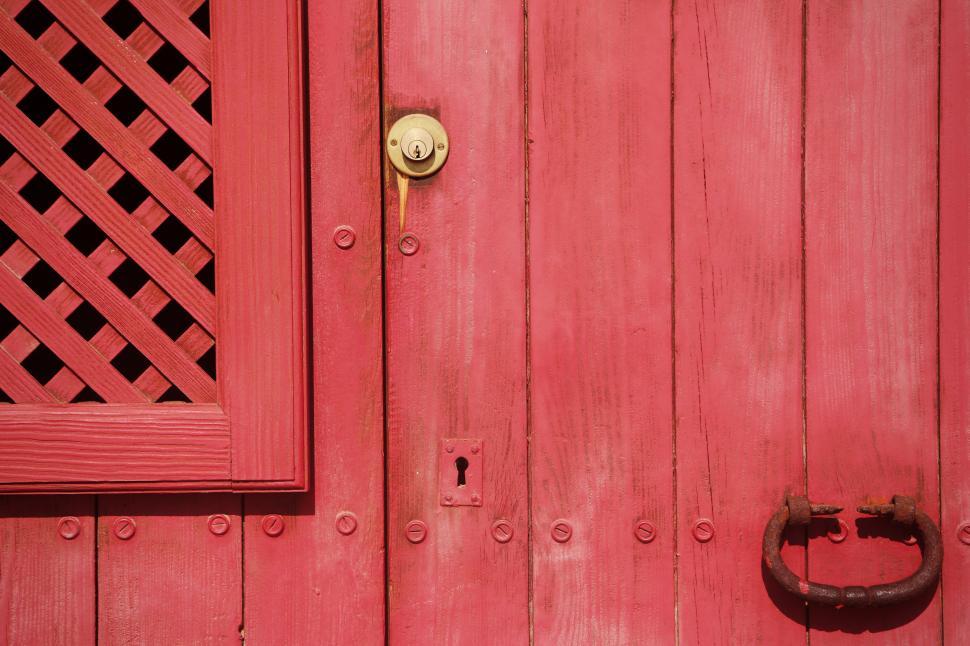 Free Image of Close Up of a Red Door With Metal Handle 
