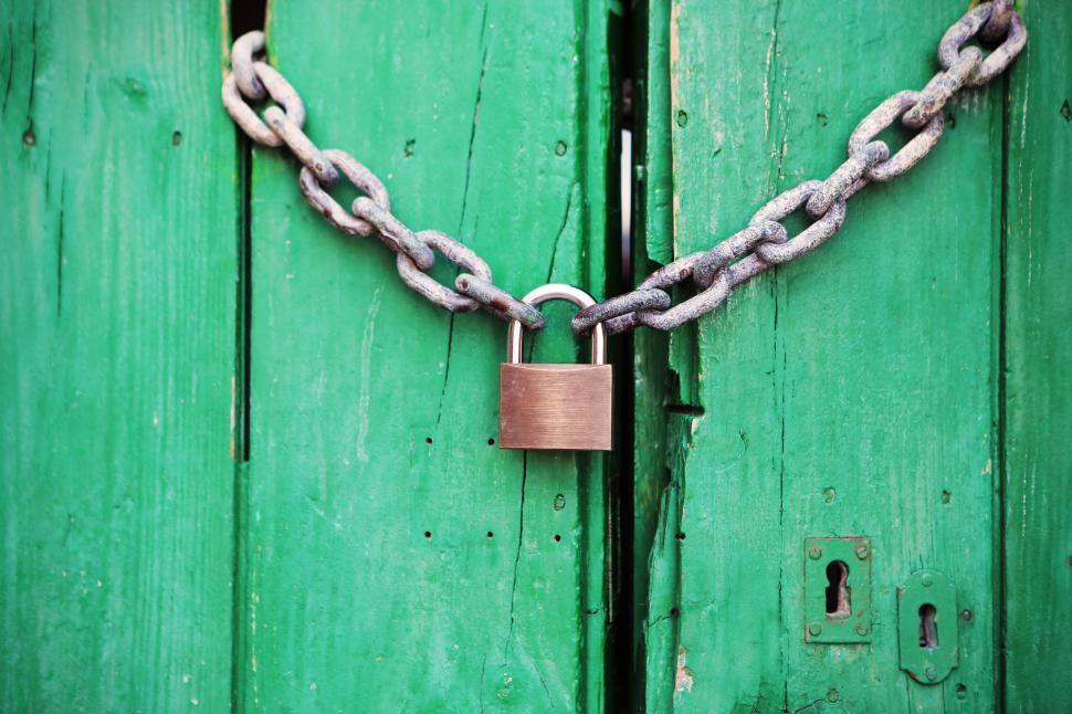 Free Image of Green Door With Attached Padlock 