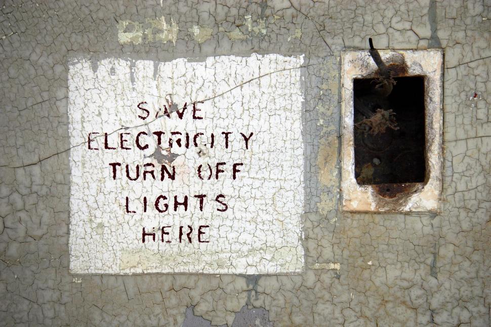 Free Image of Destroyed electrical outlet and sign 