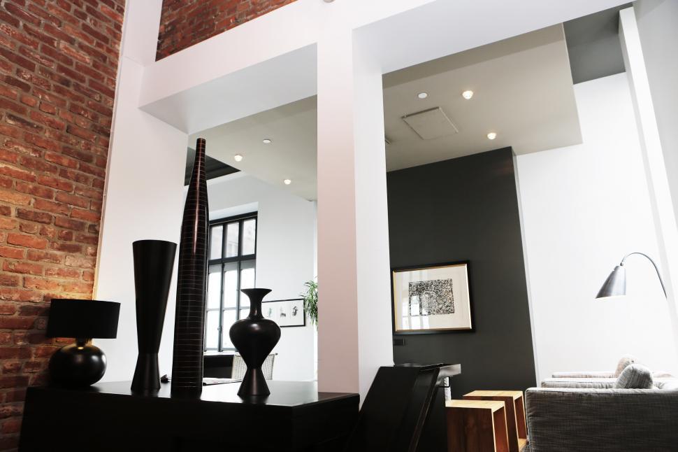 Free Image of A Living Room With Furniture and Brick Wall 