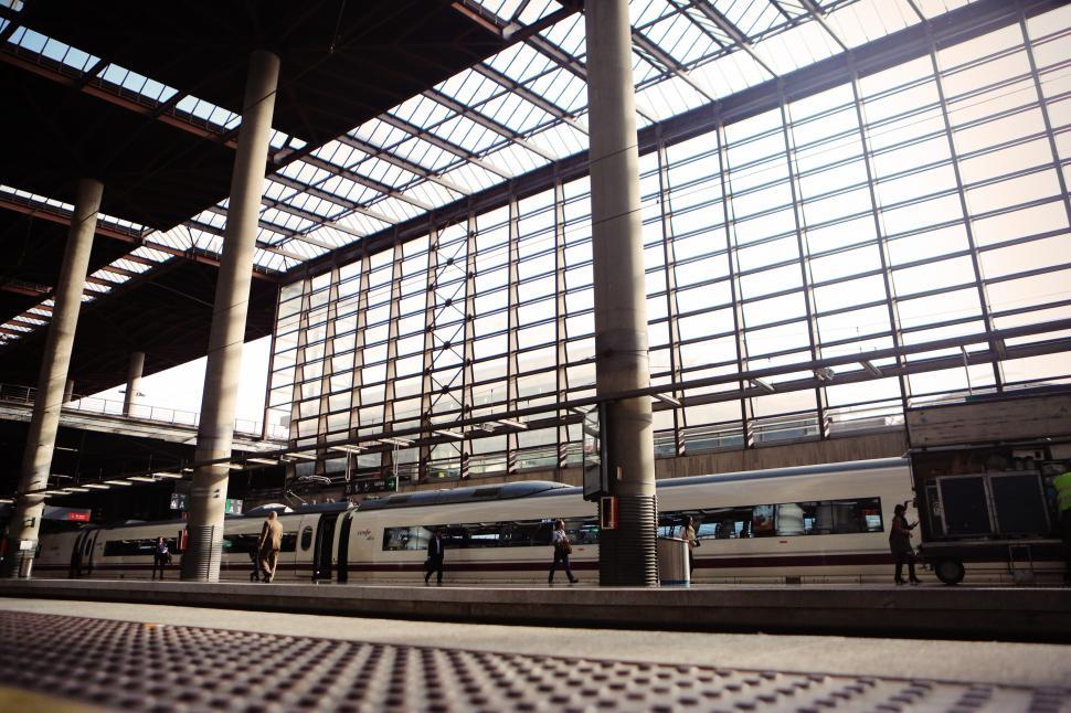 Free Image of Train Station With Train Parked Next to Platform 