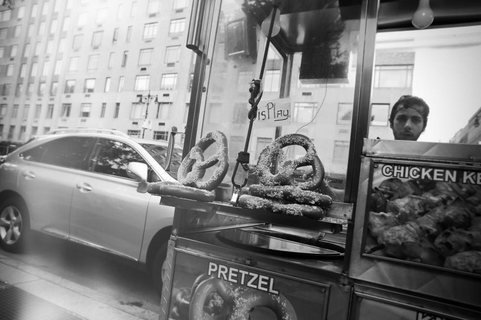 Free Image of A Black and White Photo of a Doughnut Stand 