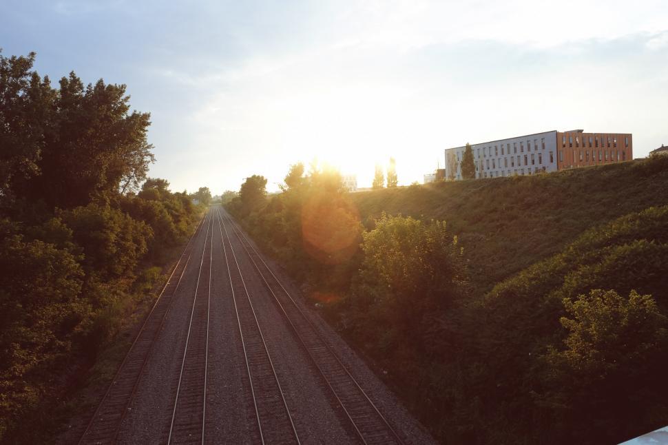 Free Image of Sun Setting Over Train Track 