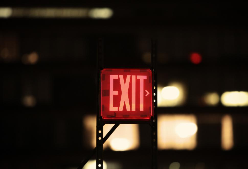 Free Image of Red Exit Sign in Dark Room 