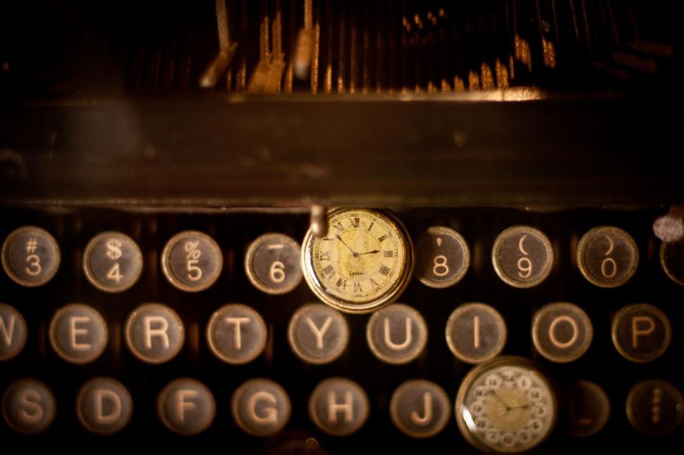 Free Image of Close Up of Clock on Vintage Typewriter 