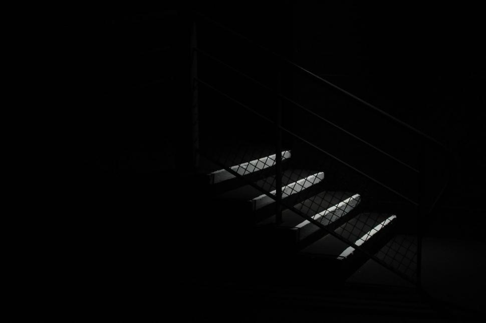 Free Image of Staircase Illuminated by Light in Dark Room 