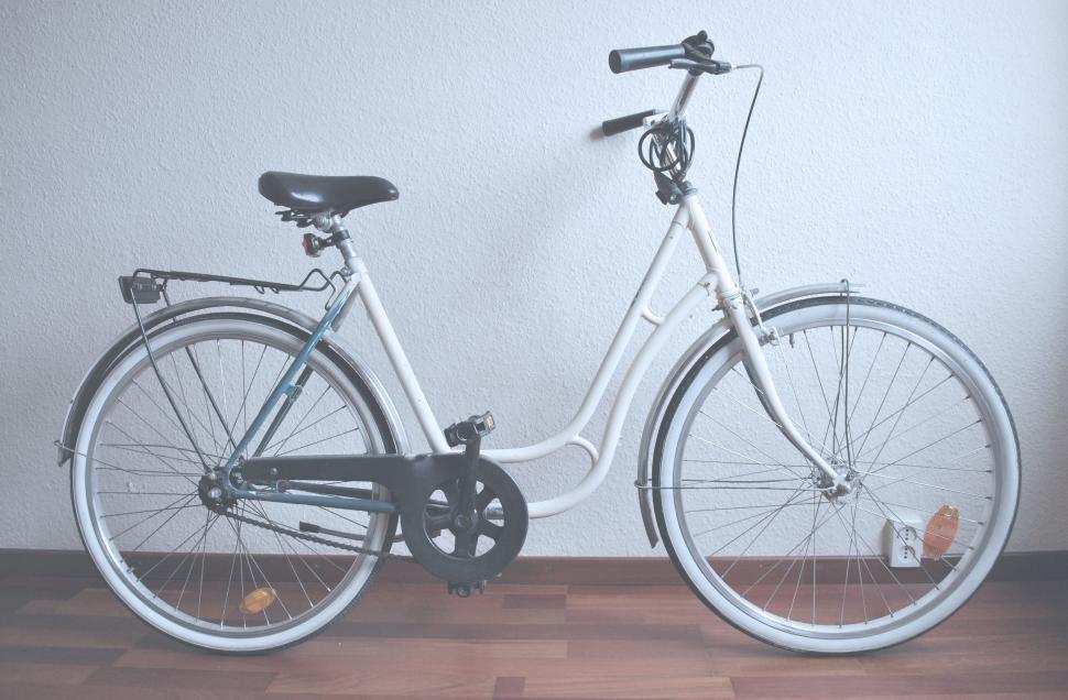 Free Image of White Bicycle Leaned Against White Wall 