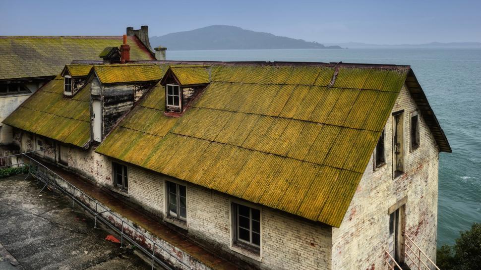 Free Image of Thatched Roof House by Ocean 