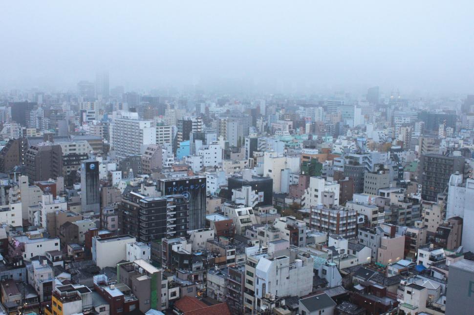 Free Image of Aerial View of City Shrouded in Fog 