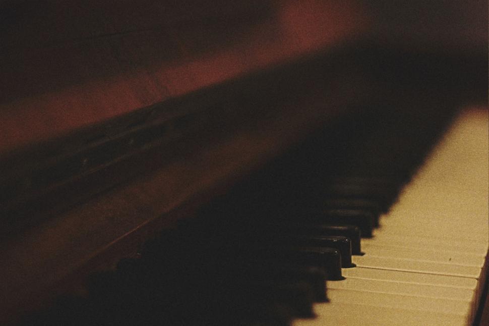 Free Image of Close Up of a Piano Keyboard in a Dark Room 