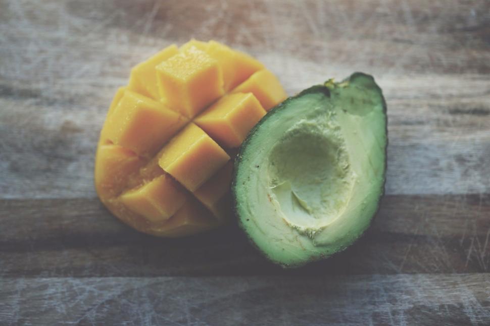 Free Image of Halved Avocado on Wooden Table 