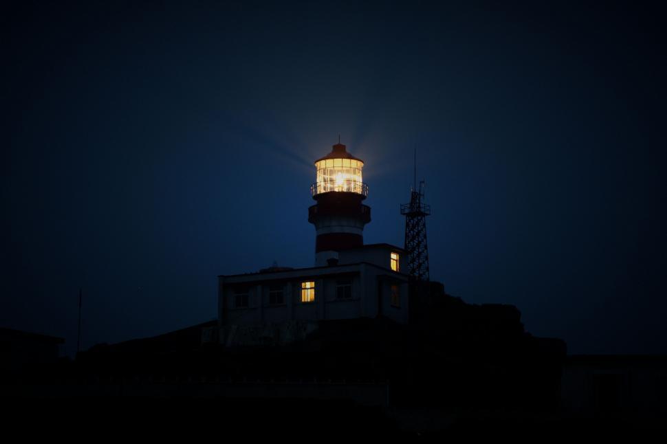 Free Image of Moonlit Night With Lit Light Tower 