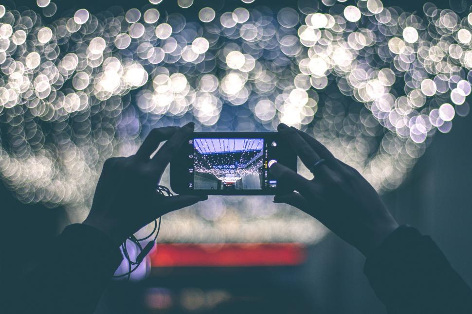 Free Image of Person Capturing Fireworks Display on Camera 