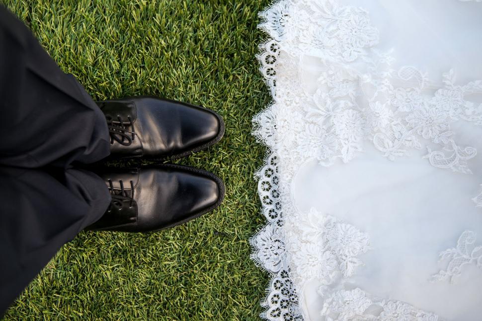 Free Image of Close Up of Bride and Grooms Wedding Shoes 