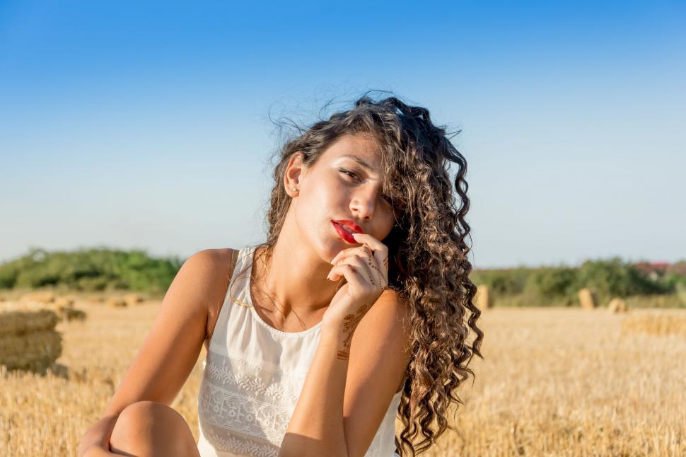 Free Image of Woman Sitting in Field 