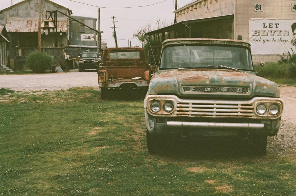 Free Image of Old Truck Parked in Front of Building 