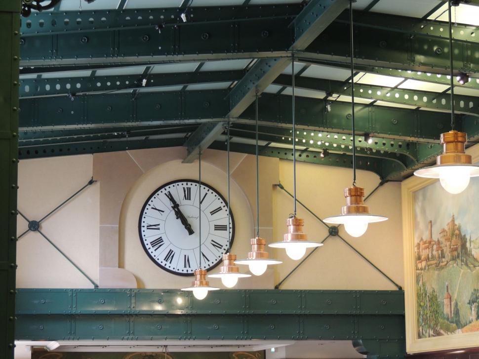 Free Image of Large Clock Mounted to Side of Wall 