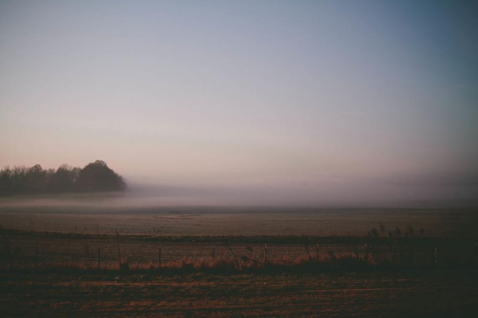 Free Image of Foggy Landscape With Small Island in Distance 