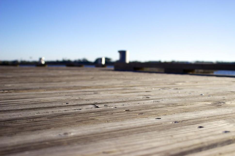 Free Image of Skateboard Resting on Wooden Deck 