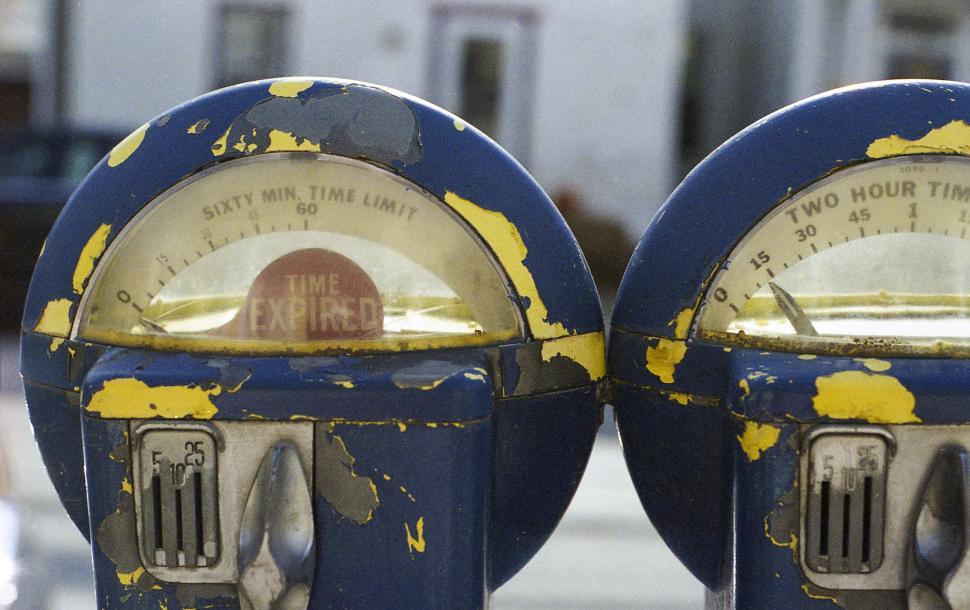 Free Image of Close Up of Two Parking Meters on a Street 