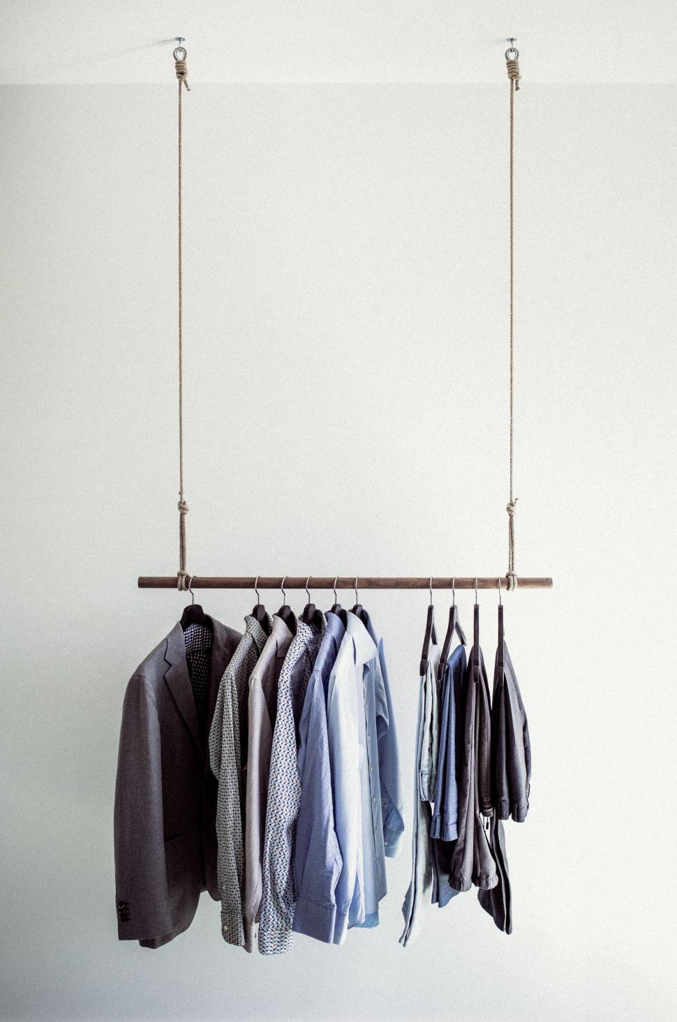 Free Image of Assorted Shirts Hanging on a Rack 