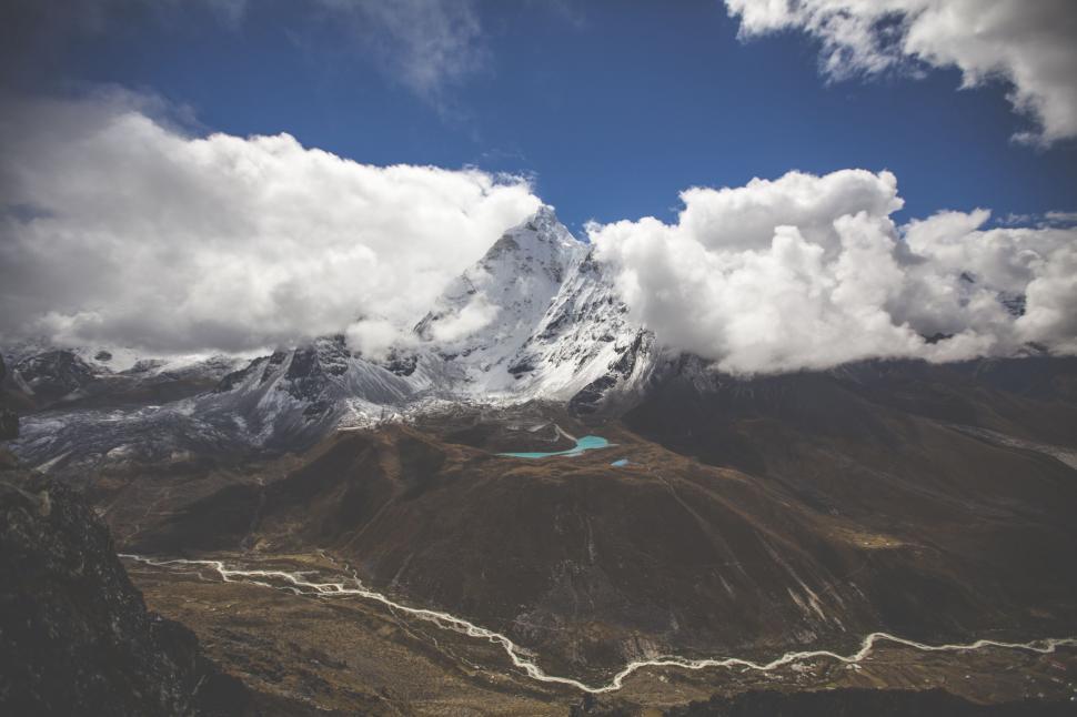 Free Image of Majestic Mountain With Clouds in the Sky 