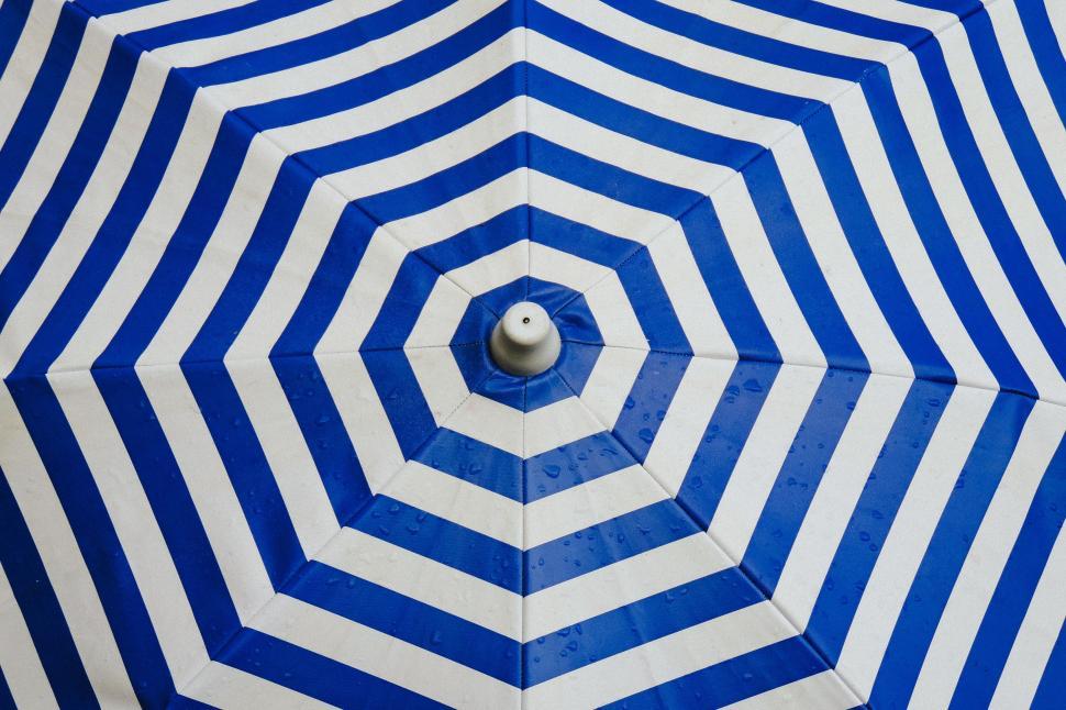 Free Image of Close Up of Blue and White Umbrella 