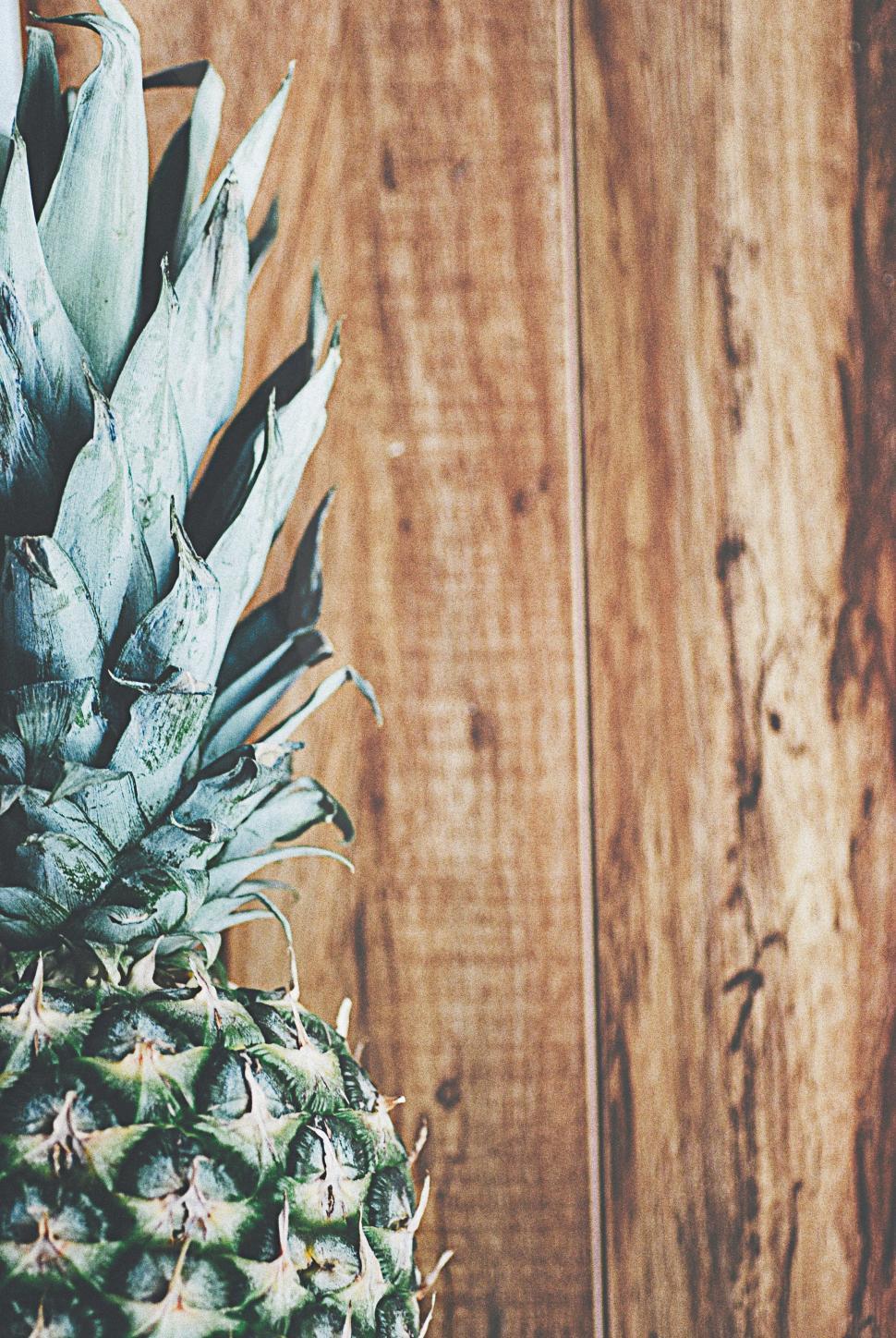 Free Image of Close Up of Pineapple on Wooden Table 