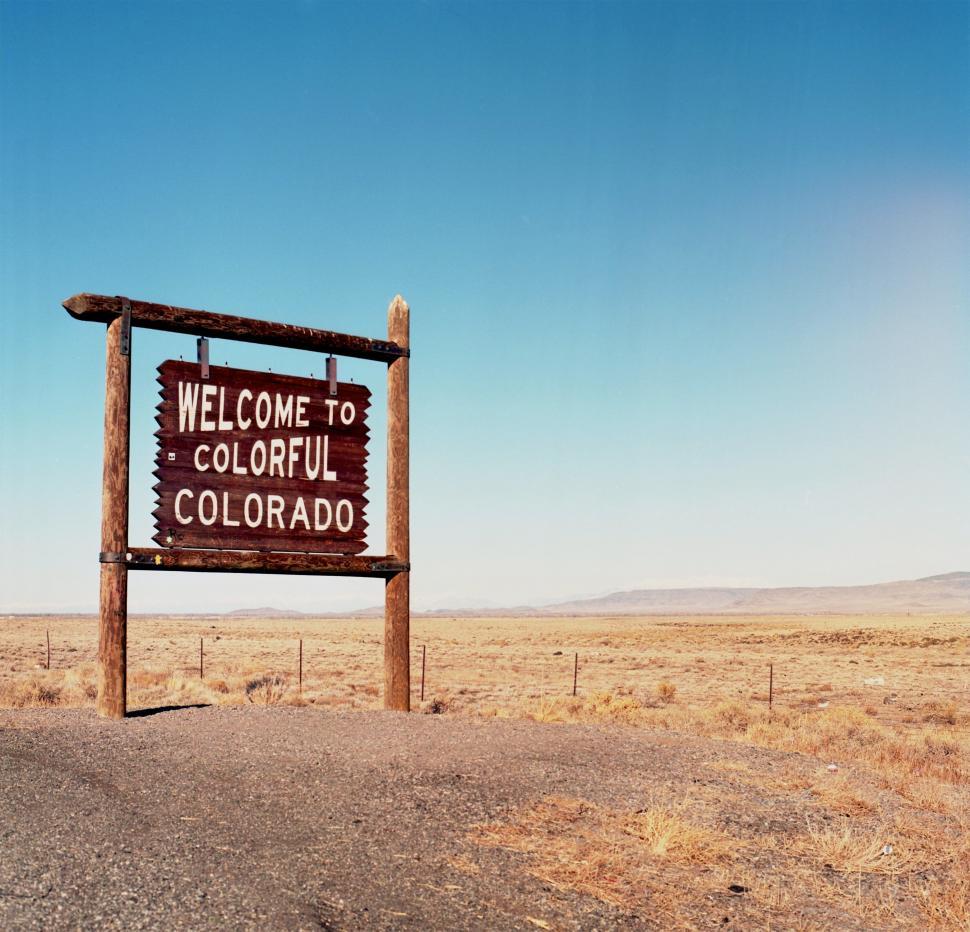 Free Image of Welcome Sign Standing in Middle of Desert 