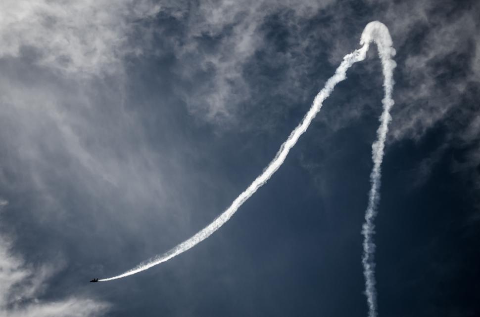 Free Image of Airplane Leaving Smoke Trail in the Sky 