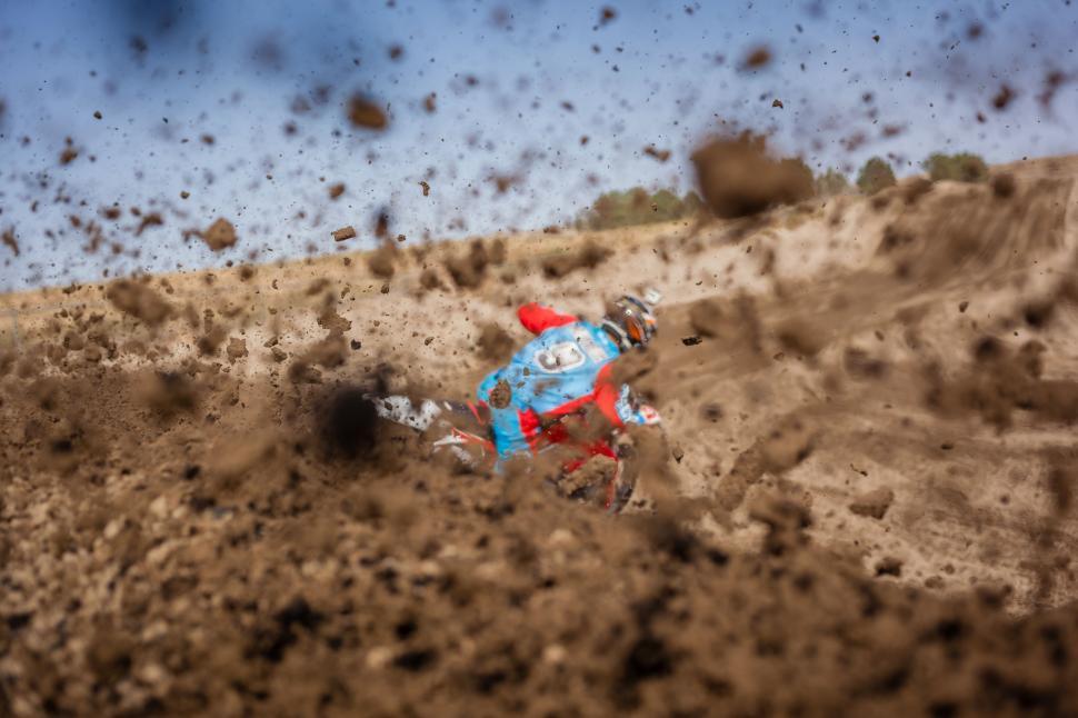 Free Image of Person Riding a Dirt Bike on a Dirt Track 