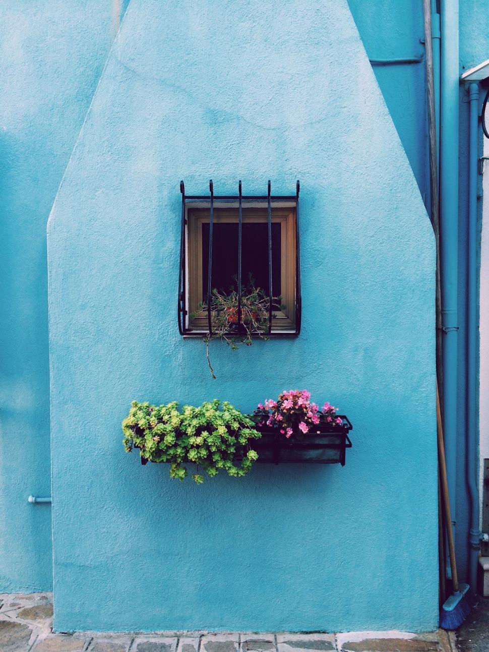 Free Image of Blue Building With Window and Planter 