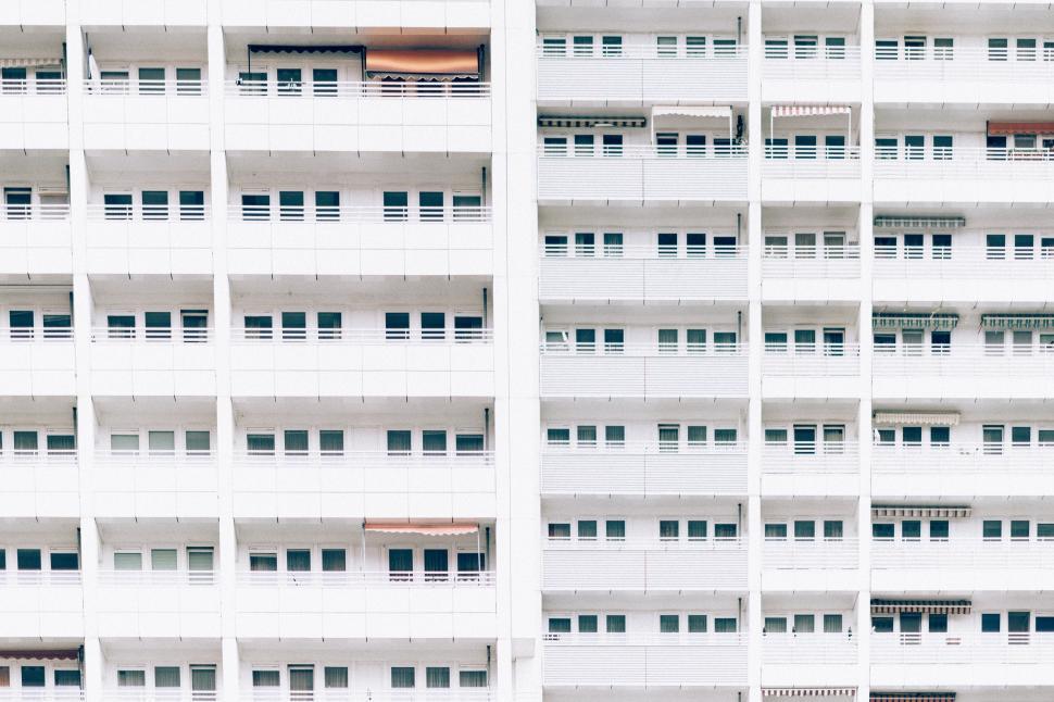Free Image of Tall White Building With Many Windows 