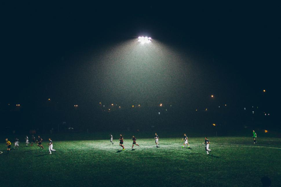 Free Image of Group of People Playing Soccer on a Field 