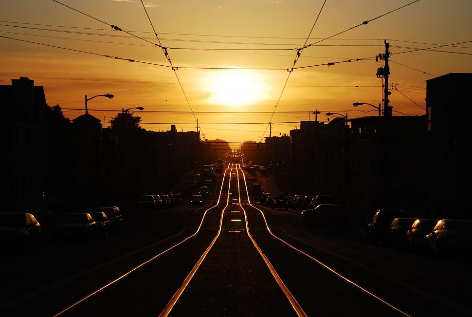 Free Image of Sun Setting Over Train Track 