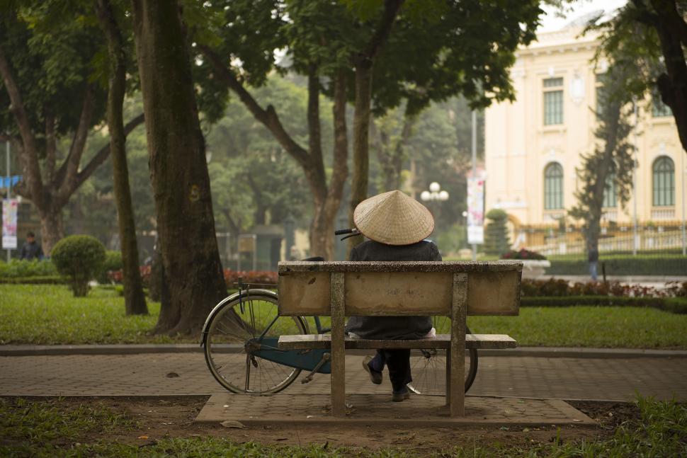 Free Image of Person Sitting on Bench in Park 