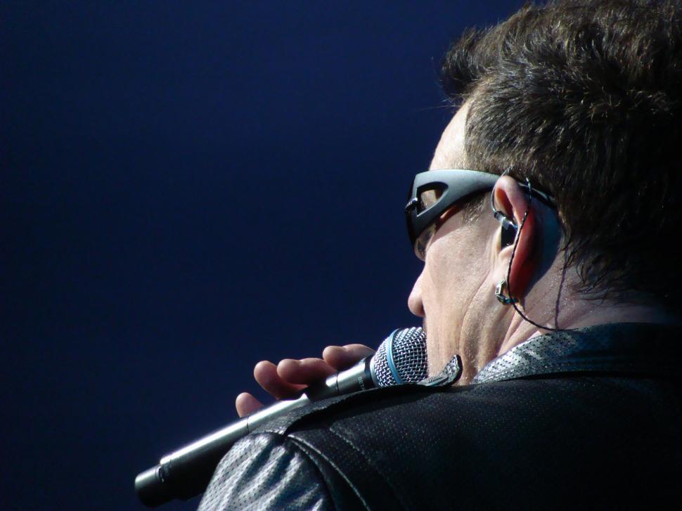 Free Image of A Man Holding a Microphone 