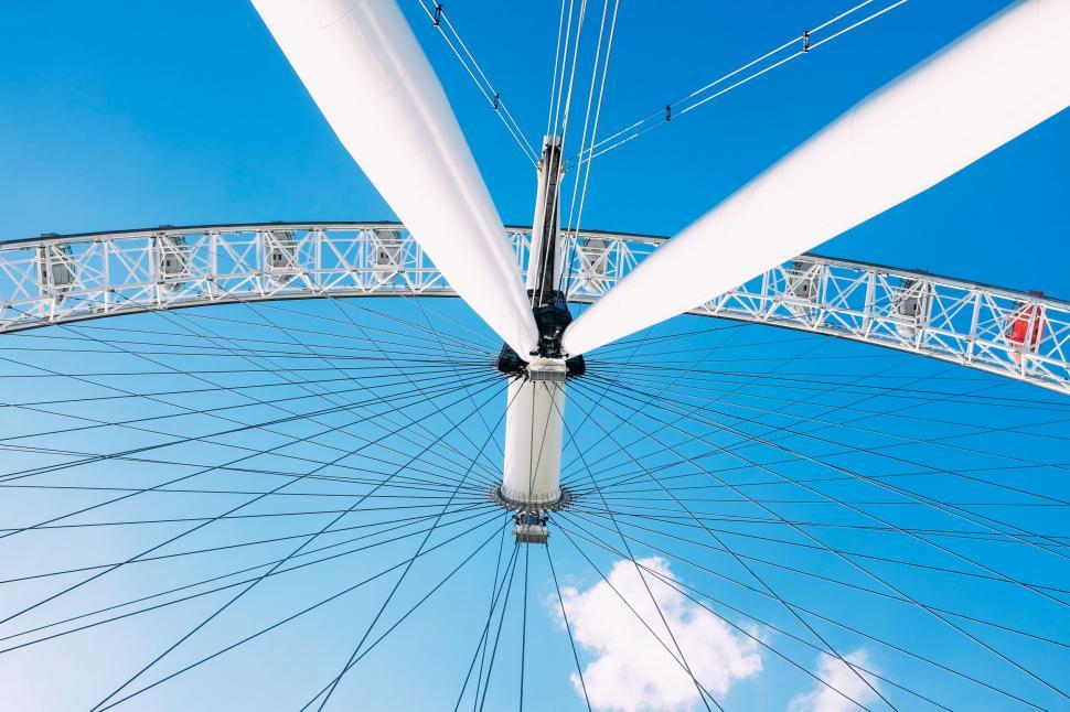 Free Image of Large White Ferris Wheel Under a Blue Sky 
