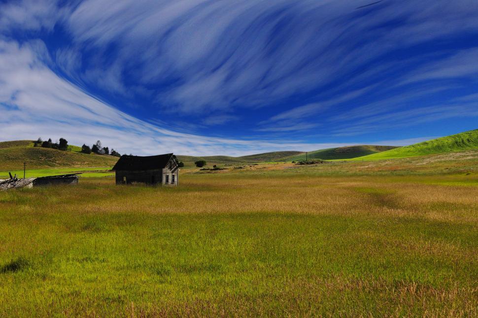 Free Image of House in the Middle of a Large Open Field 