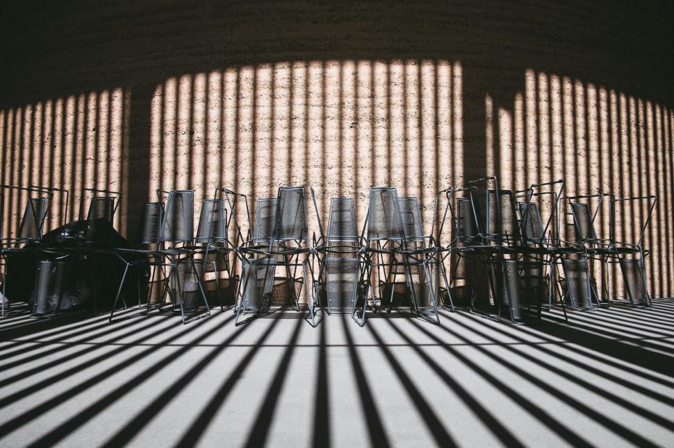 Free Image of Shadows of Chairs Cast on Wall 