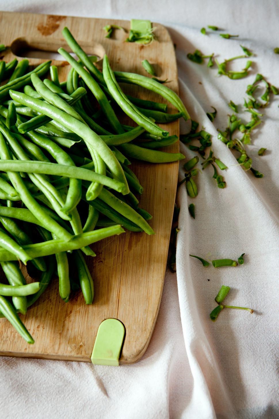 Free Image of Wooden Cutting Board With Green Beans 