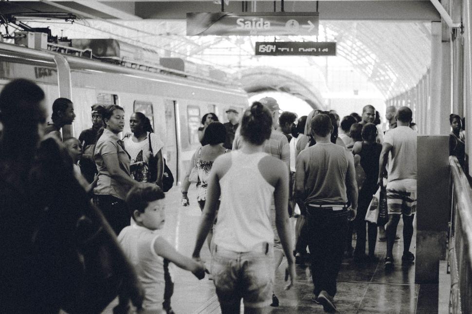 Free Image of People Boarding a Train at a Busy Station 