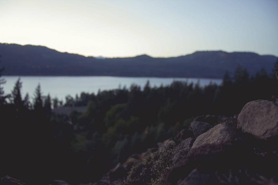 Free Image of Blurry Lake With Mountains in Background 