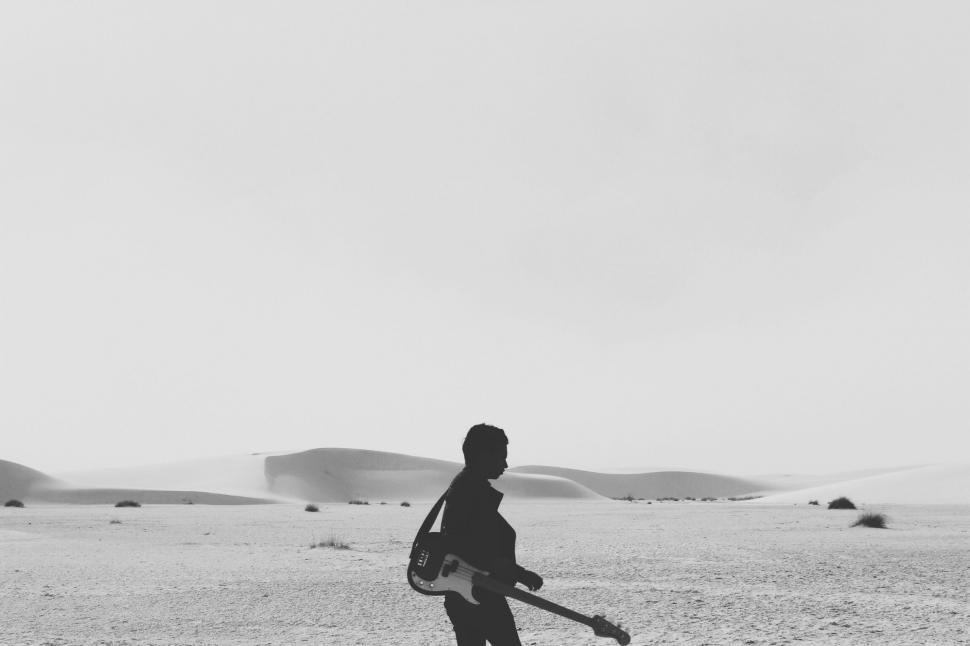 Free Image of Person Walking in the Desert 