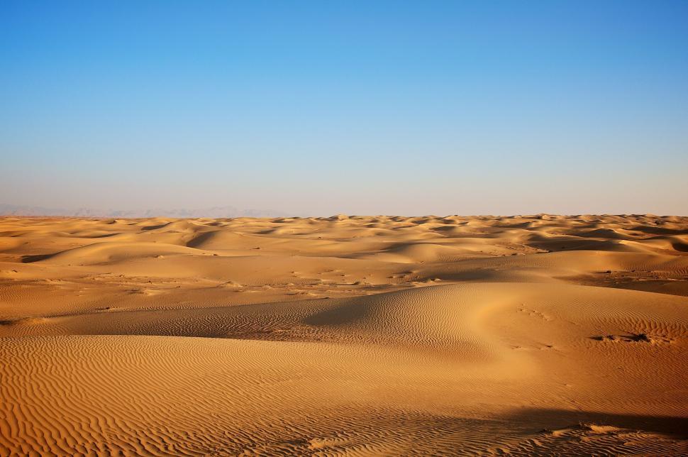 Free Image of Desert Landscape With Sand Dunes and Blue Sky 