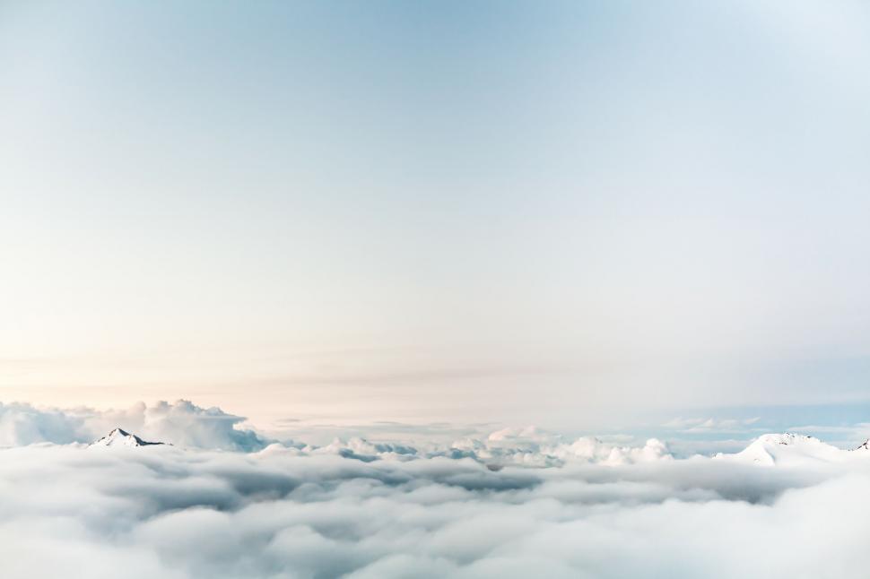 Free Image of Plane Flying Above Clouds in the Sky 