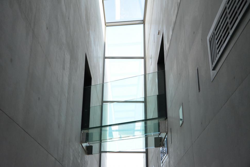 Free Image of Narrow Hallway With Window and Skylight 