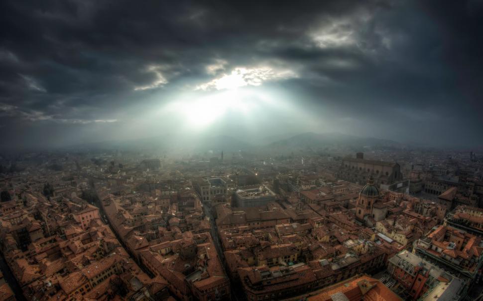 Free Image of Aerial View of City Under Cloudy Sky 